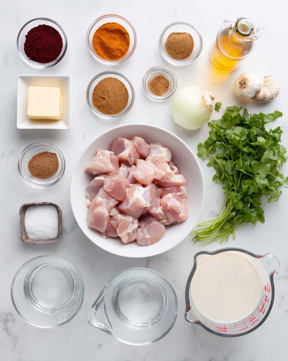 The image shows various white bowls and small glass dishes arranged neatly on a white marbled surface. In the center is a white bowl filled with raw chicken pieces that are pale pink in color. To the right of the bowl, there is a bunch of fresh green cilantro, a whole white onion, a bulb of garlic, and a small piece of ginger root. Small glass bowls at the top hold different ground spices in shades of brown, orange, and tan. On the left side, there is a small square container with a pale yellow block of butter, a small glass bowl of salt, a small jar with a dark red powder, and a clear glass measuring cup with white liquid. There are also two glass measuring cups, one filled with water and the other with a creamy white liquid, plus a bottle of golden oil. The setup is clean and bright, arranged in an organized, flat-lay style. photo taken with an iphone --ar 4:5 --v 7