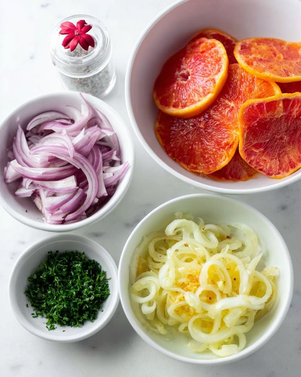 The image shows four white bowls on a white marbled surface. The largest bowl, placed on the right side, contains several slices of bright red and orange citrus fruits layered on top of each other. Below it, another large bowl holds pale yellow, curly fennel slices that appear fresh and juicy. On the upper left, a medium bowl is filled with thinly sliced red onion, showing layers of purple and white. Below this bowl, a small bowl contains finely chopped parsley, a vibrant green. There is also a clear salt shaker with a red flower decoration near the top center of the image. Photo taken with an iphone --ar 4:5 --v 7
