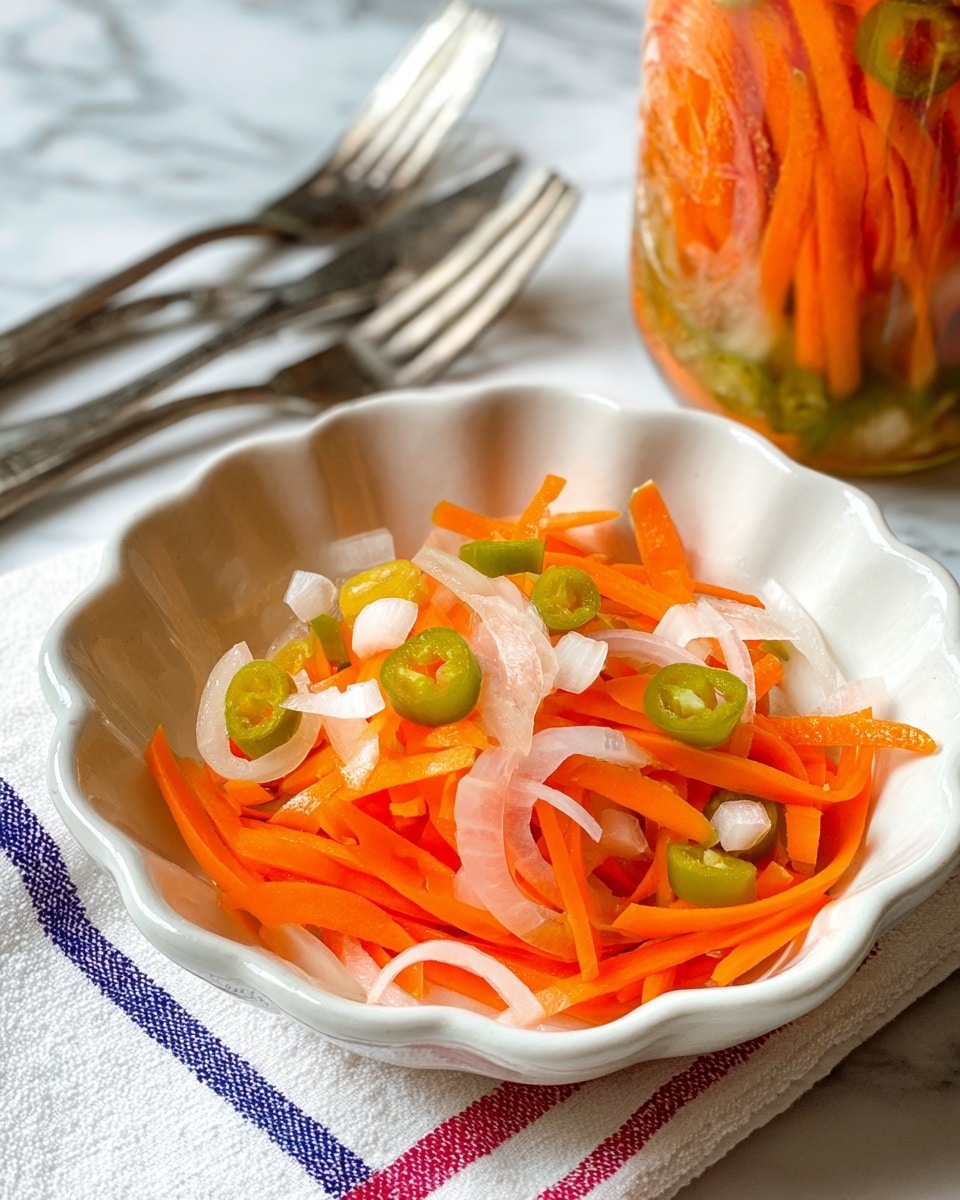 The image shows a white, scalloped bowl filled with a mix of thin orange carrot sticks, small white onion pieces, and small green chili slices scattered on top. The bowl sits on a white marbled surface with a white cloth underneath that has red and blue stripes. In the background, part of a jar filled with similar carrot and green chili slices is visible, along with three silver forks. A woman's hand is not shown but implied as the utensils suggest readiness to serve. The photo taken with an iphone --ar 4:5 --v 7