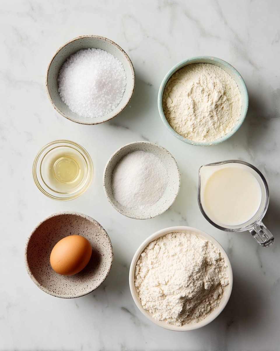 A top view of six small bowls and a glass measuring cup arranged on a white marbled surface, each holding a different baking ingredient: on the top left, a small round bowl with white coarse salt, next to it a similar bowl with white powder (likely baking powder), on the middle left a small glass cup containing clear oil, center a small speckled bowl with fine white sugar, bottom left a small bowl holding a single brown egg, and bottom right a bowl filled with white flour, the glass measuring cup on the top right contains white milk. photo taken with an iphone --ar 4:5 --v 7
