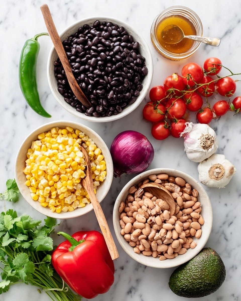 The image shows a white bowl filled with black beans, with a wooden spoon resting inside it. Next to it, there is another white bowl containing light brown beans with a wooden spoon also inside. A third white bowl holds yellow corn kernels. Around the bowls, there is a whole red bell pepper, a bunch of bright red cherry tomatoes attached to green stems, a halved red onion showing its rings, a whole green avocado, a jalapeño pepper, a bulb of garlic, a small bunch of fresh green cilantro leaves, and a small glass jar with a light brown liquid. All items are placed on a white marbled surface. Photo taken with an iphone --ar 4:5 --v 7