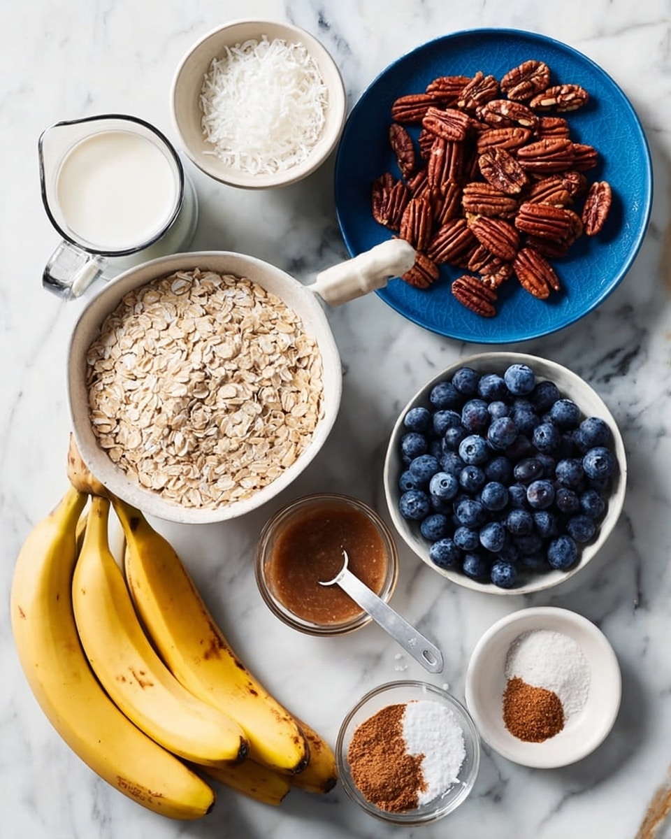 The image shows several ingredients arranged on a white marbled surface. There is a white bowl filled with fresh blueberries on the right side. Above it, a small blue plate holds pecans with a rich brown color and a smooth texture. To the left, a larger blue bowl contains light beige oats with a scoop inside. Above it, a small white bowl is filled with white coconut flakes. In the center, a glass jug with a handle holds white milk. Below the jug, three yellow bananas with small brown spots rest on the surface. On the bottom right, a small white plate holds a measuring cup filled with brown almond butter, with small piles of white powder and brown cinnamon beside it. A hand with visible fingernail is pointing near the oats bowl. Photo taken with an iphone --ar 4:5 --v 7