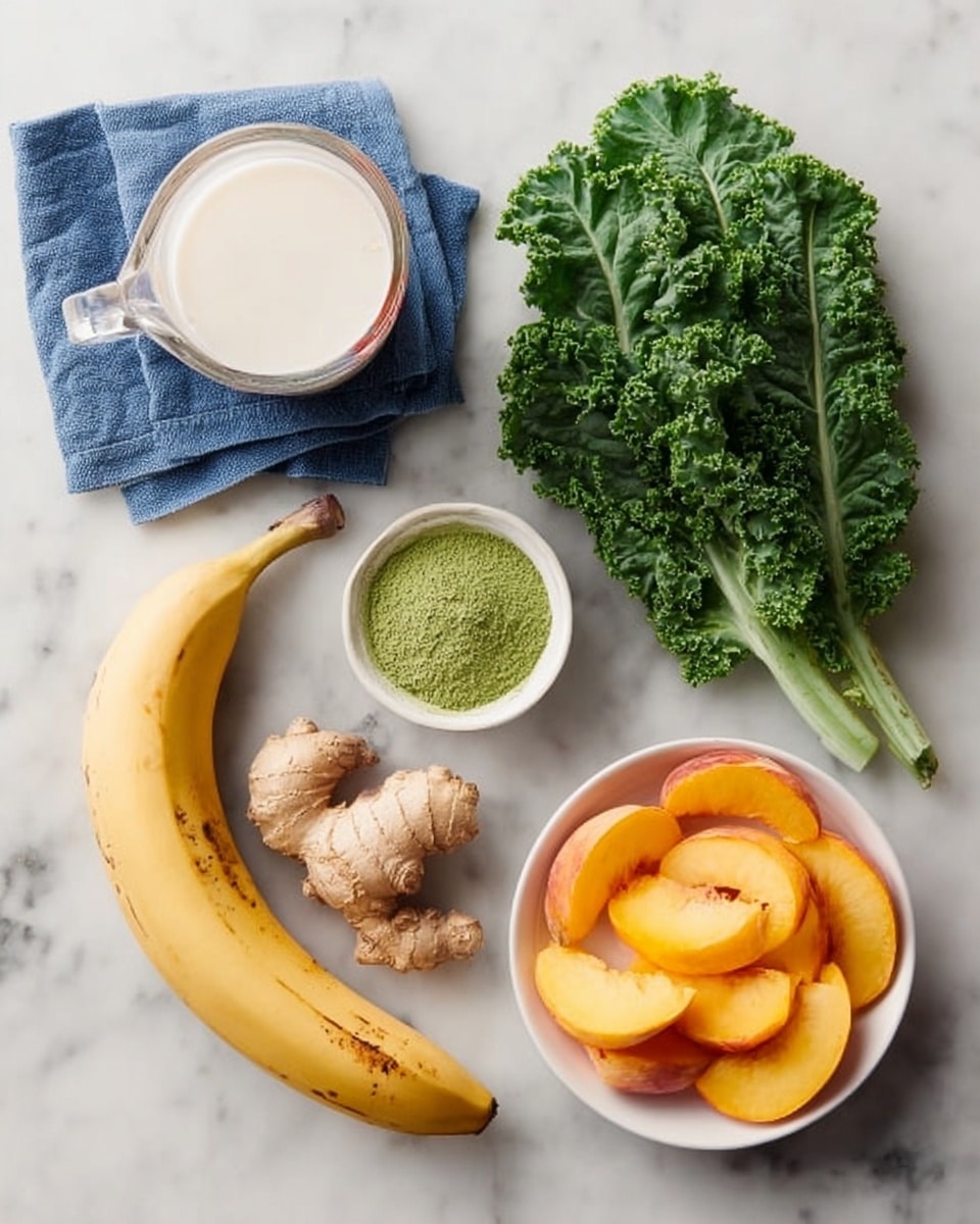 The image shows fresh ingredients neatly placed on a white marbled surface. There is a clear glass measuring cup filled with a white liquid on the top left, next to a blue cloth. Below it, a small white bowl holds bright green powder. To the right of the bowl, two large leafy green kale pieces lie flat. A piece of light brown ginger root with a knobby texture is near the center left. At the bottom left, there is a ripe yellow banana with some brown spots. In the center bottom, a white bowl contains several orange-yellow peach slices arranged in a circular pattern. photo taken with an iphone --ar 4:5 --v 7