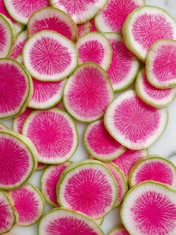 Watermelon Radish Buddha Bowl with Roasted Sweet Potatoes and Turmeric Tahini Sauce Recipe