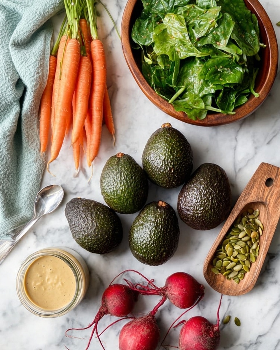 The image shows six dark green avocados with rough skin placed on a white marbled surface near a bunch of small orange carrots with green tops on the left. On the top right, there is a wooden bowl filled with fresh green leafy vegetables, and next to it is a small wooden scoop full of green pumpkin seeds. Below the bowl and seeds, there are five red beets with brown leafy stems arranged on the surface. A small glass jar with beige creamy sauce, a silver spoon inside, and a light blue cloth are on the top left corner. photo taken with an iphone --ar 4:5 --v 7