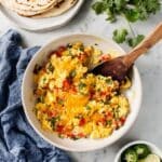 Austin-Style Migas with Tortilla Chips, Tomatoes, and Fresh Cilantro Recipe
