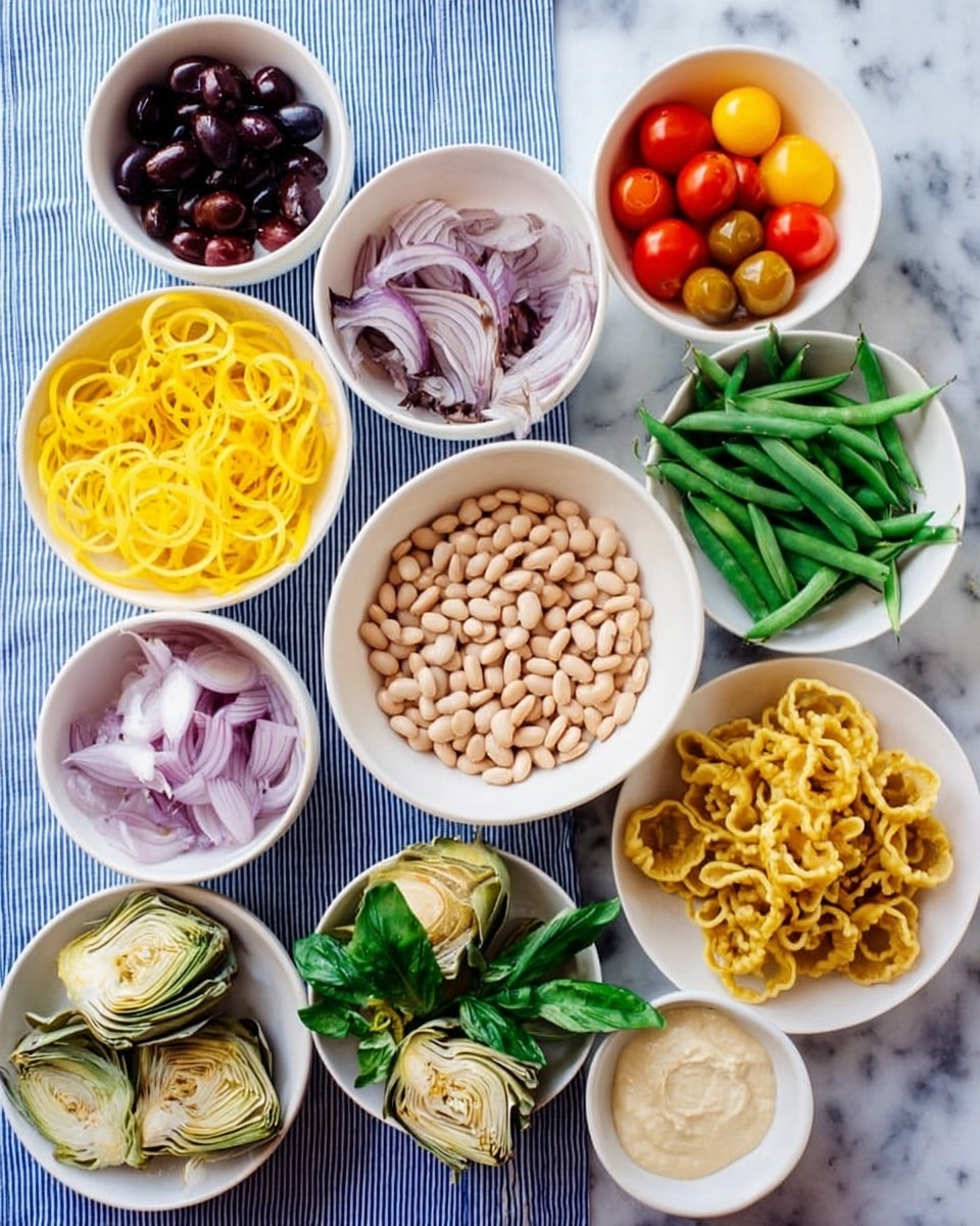 The image shows a top view of nine white dishes arranged on a blue and white striped cloth over a white marbled surface. The center features a bowl filled with light beige beans. Surrounding it are various ingredients in separate white bowls: bright yellow spiralized squash in the bottom left, yellow and red cherry tomatoes halved in the top middle, green snap peas on the right, and light-colored creamy sauce in the top far right. Also present are sliced purple olives in the top left, thinly sliced red onions next to fresh green basil leaves in the bottom left, artichoke hearts in the bottom middle, and a plate of curly yellow pasta in the bottom right. A woman's hand is not visible in this image. Photo taken with an iphone --ar 4:5 --v 7