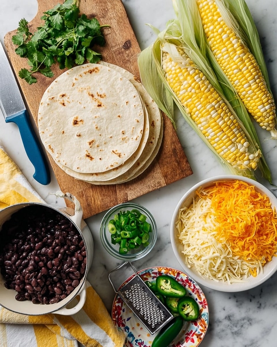 The image shows a food preparation scene on a white marbled surface. In the center, there is a wooden board holding a stack of light beige tortillas with some green cilantro leaves on top and to the side. Next to the board is a large knife with a blue handle. Nearby, two ears of corn with yellow kernels and green husks rest on the surface. On the right side, a white bowl holds three layers of shredded cheese in white, light yellow, and bright orange colors with a metallic grater resting on it. Below the bowl, a small white pot filled with black beans is set with a handle visible. Next to the pot, there is a small glass bowl with bright green sliced scallions. At the bottom right, there is a small colorful painted plate holding whole and sliced dark green jalapeños. A yellow and white striped cloth is partially visible under the small bowl and plate. Photo taken with an iphone --ar 4:5 --v 7