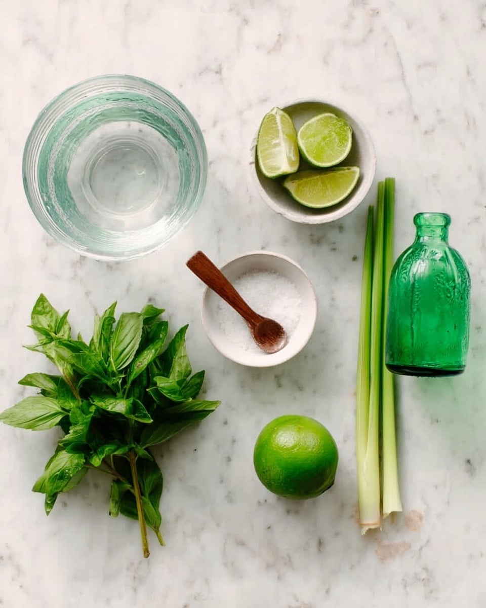 The image shows a top view of various fresh ingredients arranged neatly on a white marbled surface. From left to right, there is a transparent glass bowl with water, a small white bowl holding lime wedges, three stalks of lemongrass standing upright, a whole green lime, a small white bowl filled with salt and a small wooden spoon resting inside it, an empty transparent green glass bottle, and a bundle of fresh green herbs including mint and basil with rich textures and vibrant colors. The overall scene is clean and bright with natural light. Photo taken with an iphone --ar 4:5 --v 7